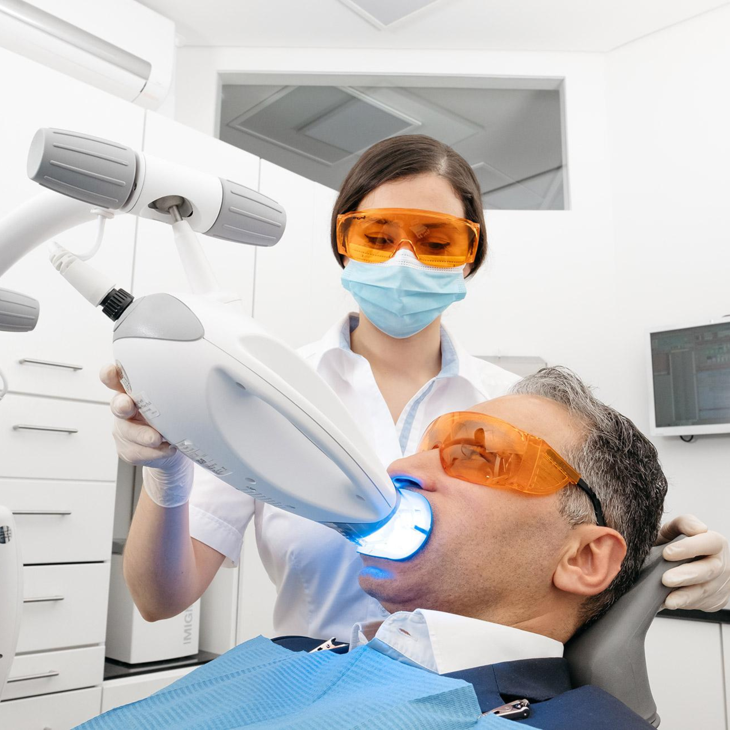 Smiling patient showing bright white teeth