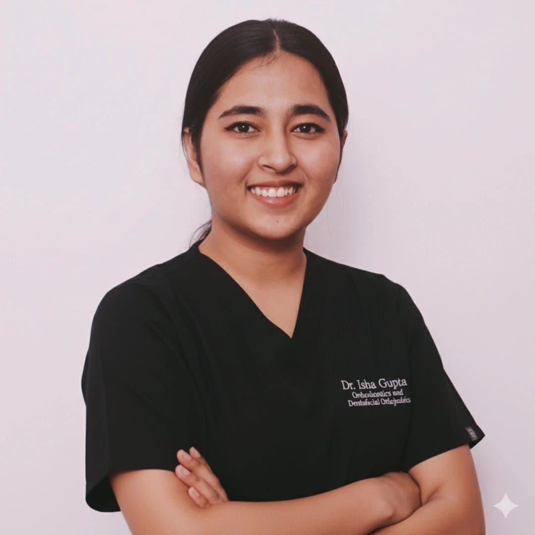 Dr. Isha, orthodontist and smile design specialist, posing in a professional setting